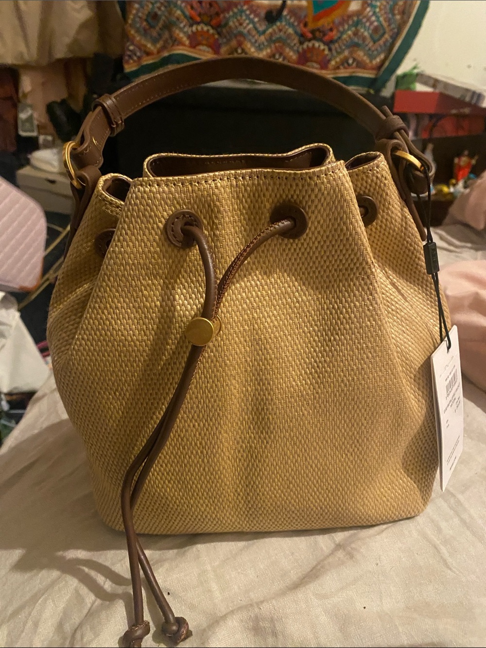 Reiiss Straw-Texture Drawstring Bucket Bag in Tan